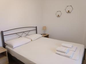 A bed or beds in a room at Evi's home