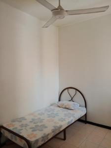 Postel nebo postele na pokoji v ubytování Homestay Idaman Penang