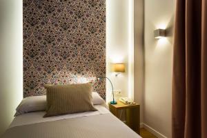 Posteľ alebo postele v izbe v ubytovaní Hotel Comfort Dauro 2
