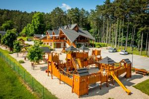 an aerial view of a playground in front of a house at Salaš Vígľaš in Bojnice