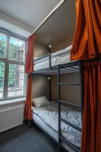 Postel nebo postele na pokoji v ubytování Happy Street Hostel