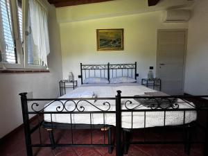 Postel nebo postele na pokoji v ubytování IL Poggio
