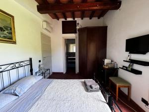 Postel nebo postele na pokoji v ubytování IL Poggio