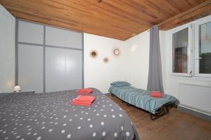 Postel nebo postele na pokoji v ubytování Le Gîte des 3000 avec Spa