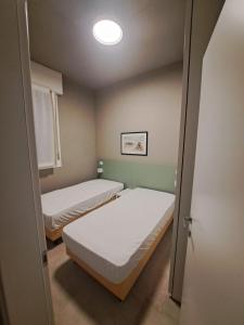 En eller flere senge i et værelse på Villa Taormina