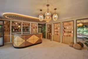 a large room with a counter and some lights at Regent Resort Budva in Budva