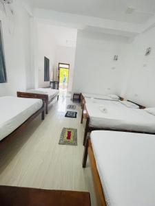 Postel nebo postele na pokoji v ubytování ZIMBAY Guest House