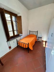Ένα ή περισσότερα κρεβάτια σε δωμάτιο στο La Casa del Borgo