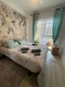 En eller flere senge i et værelse på Apartamento Arte Malaga + 16 billeder