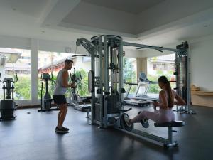 a man and a woman in a gym at Blu-Zea Resort by Double-Six in Seminyak
