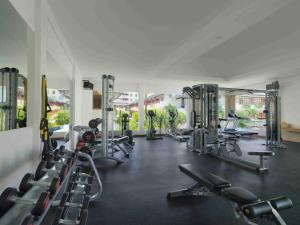 a gym with a lot of treadmills and machines at Blu-Zea Resort by Double-Six in Seminyak