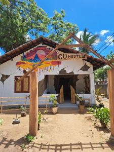 a building with a sign that sayscu hostel at C U Hostel in Trincomalee