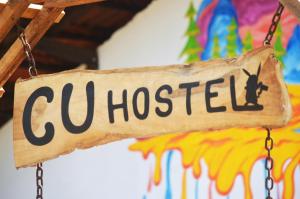 a sign that readscu hospital hanging from a chain at C U Hostel in Trincomalee