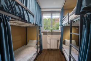 Postel nebo postele na pokoji v ubytování Happy Street Hostel