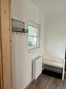Postel nebo postele na pokoji v ubytování Apartmány u rybníčka