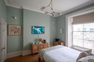 Ένα ή περισσότερα κρεβάτια σε δωμάτιο στο Lido Townhouse +28 φωτογραφίες