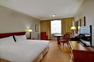 a hotel room with a bed and a desk at The Capetonian - Halal in Cape Town +150 photos