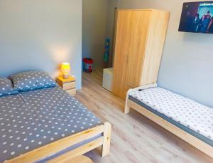 Posteľ alebo postele v izbe v ubytovaní Dobra Nocka