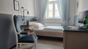Voodi või voodid majutusasutuse Hotel & Restaurant zur Post toas