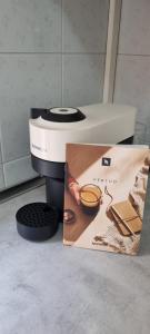 a close up of a toaster with a magazine next to it at Alba -vista unica con terrazza- in Siena