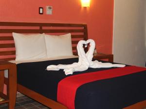 Postel nebo postele na pokoji v ubytování Hotel Soberanis
