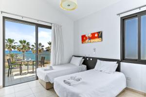 Postel nebo postele na pokoji v ubytování Platzia Beach Villas