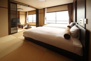Cama ou camas em um quarto em Hotel Amandi
