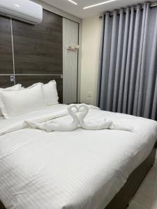 Postel nebo postele na pokoji v ubytování Golden Light Aqaba Hotel فندق جولدن لايت العقبة