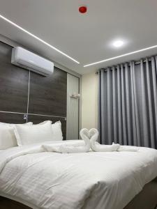 Postel nebo postele na pokoji v ubytování Golden Light Aqaba Hotel فندق جولدن لايت العقبة