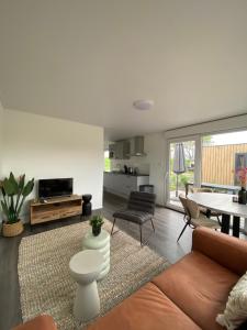 a living room with a couch and a table at Vakantiepark Lemmer in Lemmer