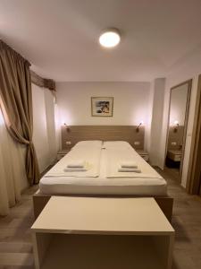 Postel nebo postele na pokoji v ubytování Minella Residence