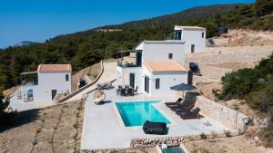 an image of a villa with a swimming pool at Lefkadian Gem Villas in Áyios Nikólaos Nirás