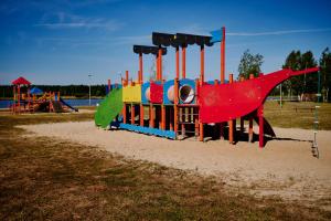 a playground in a park with a colorful train at Czyli Chill in Nisko