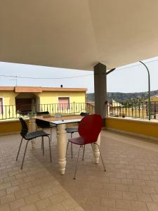 a table and chairs on top of a roof at Sole&Luna in Armungia