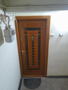 a wooden door in a room with at Apartament La Ilie in Ocna Sibiului +10 photos