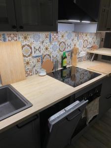 a kitchen with a sink and a counter top at West Station Apartment in Warsaw +1 photo
