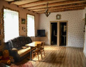 a living room with a couch and a table at BenSon Adventures Resort in Gomkʼ