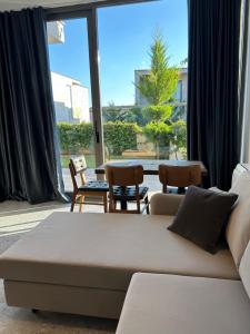 Area soggiorno di OLEA Family Apt with Garden