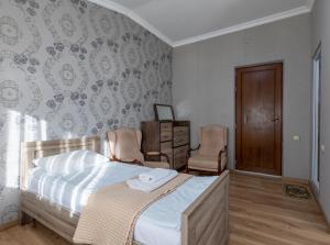 Letto o letti in una camera di Guest House Nikala