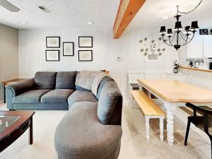 a living room with a couch and a table at Deep Creek Village #33 in McHenry