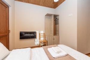 Letto o letti in una camera di Guest House Nikala