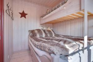 En eller flere senge i et værelse på Panorama 4 C Ski inn and out with views of Slettefjell