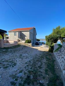 a view of the house from the driveway at Rosmarin Apartments Sea View Garden Side in Jadranovo