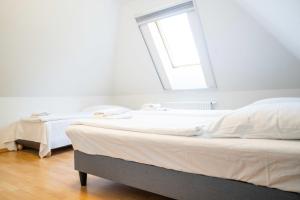 Postel nebo postele na pokoji v ubytování Windflüchter Brise