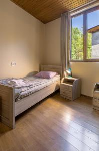 Letto o letti in una camera di Guest House Nikala