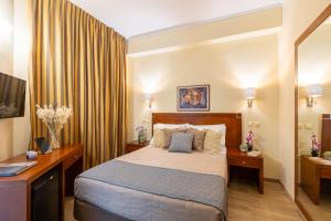 Ein Bett oder Betten in einem Zimmer der Unterkunft Hotel Marina