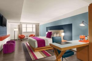 Ein Bett oder Betten in einem Zimmer der Unterkunft TRYP by Wyndham Isla Verde
