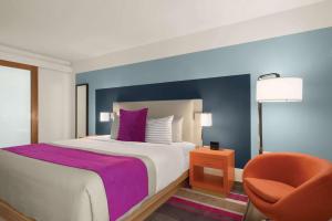Ein Bett oder Betten in einem Zimmer der Unterkunft TRYP by Wyndham Isla Verde