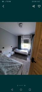 a bedroom with a bed and a window at Mohito 2 in Trupel