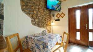 TV a/nebo společenská místnost v ubytování B&B Relax Rooms - Peschiera del Garda